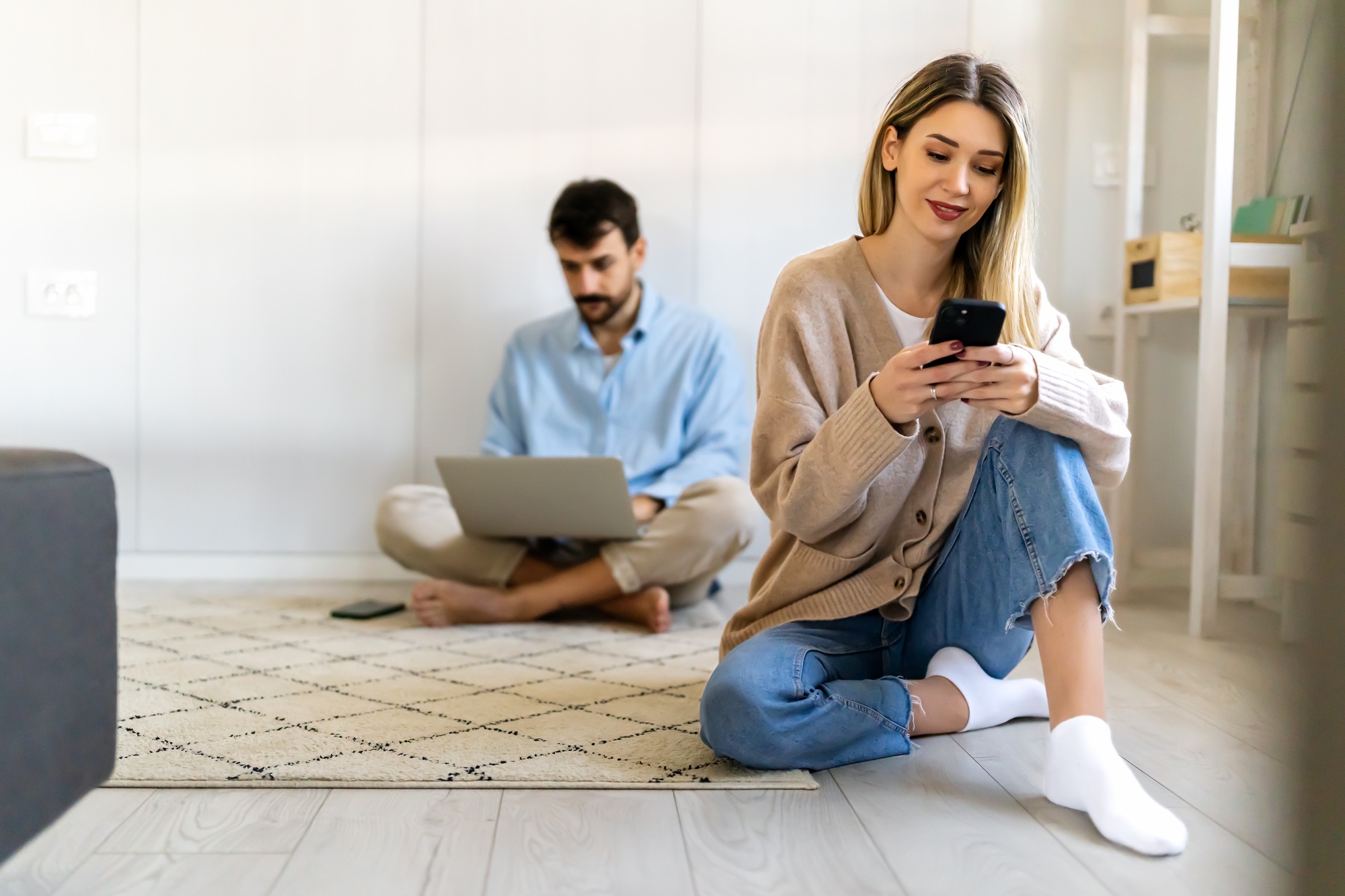 freelancing couple working together at digital devices in home office. social media people concept.