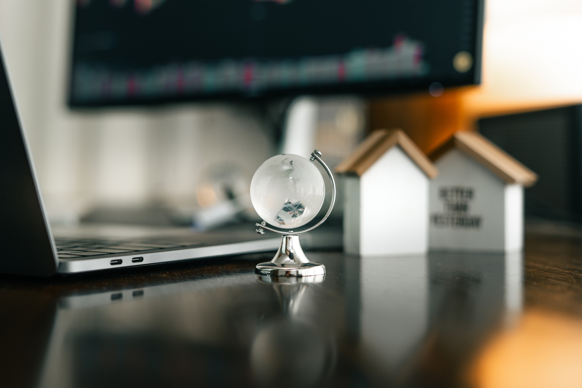 global network concept,crystal globes on desks and laptops are coming online