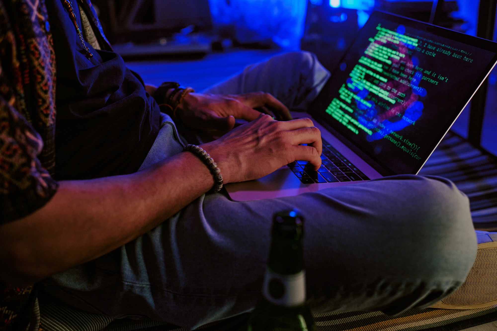 male hands typing code