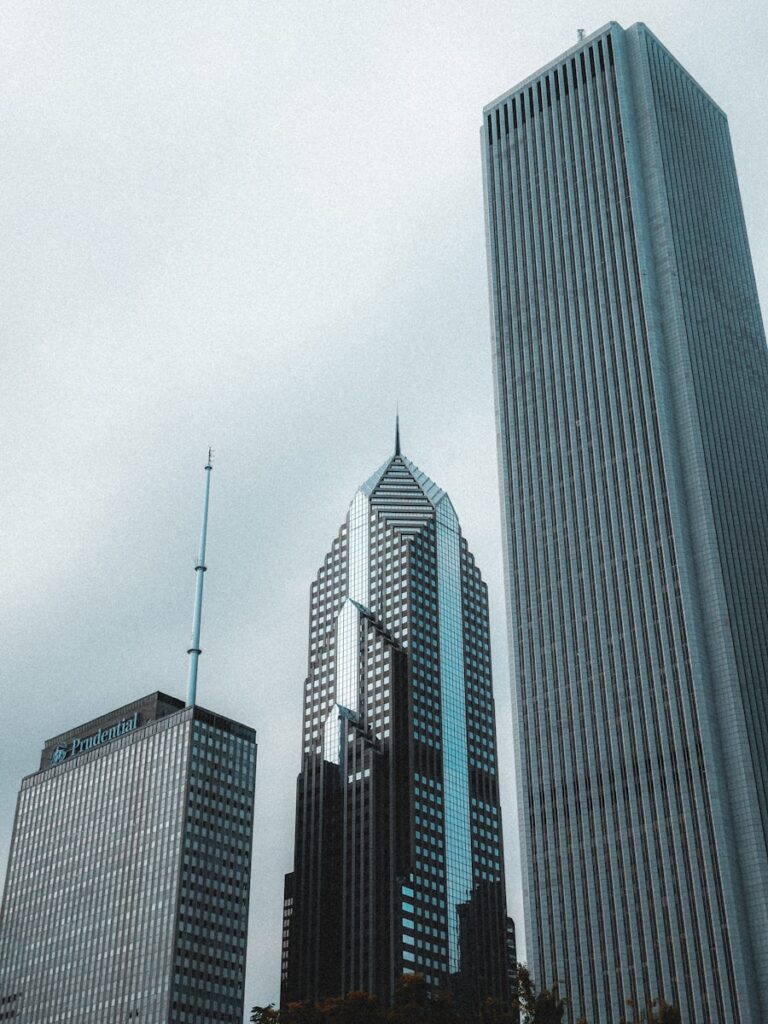 A couple of tall buildings sitting next to each other