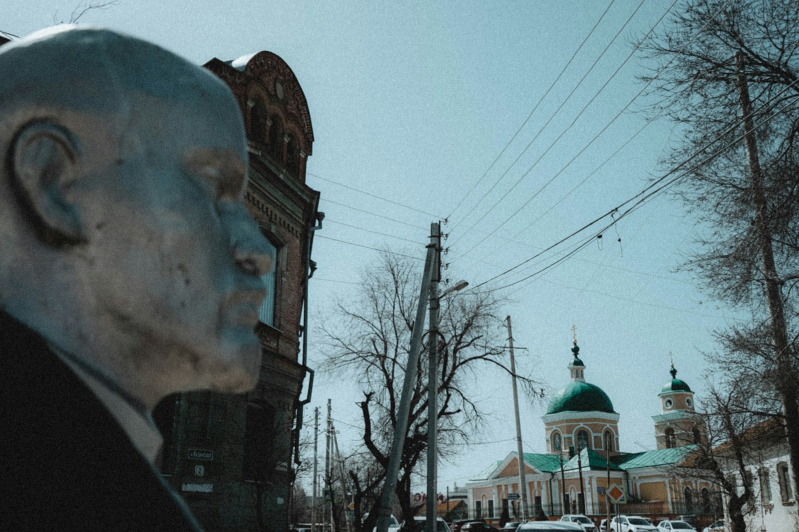 a statue of a man in front of a church