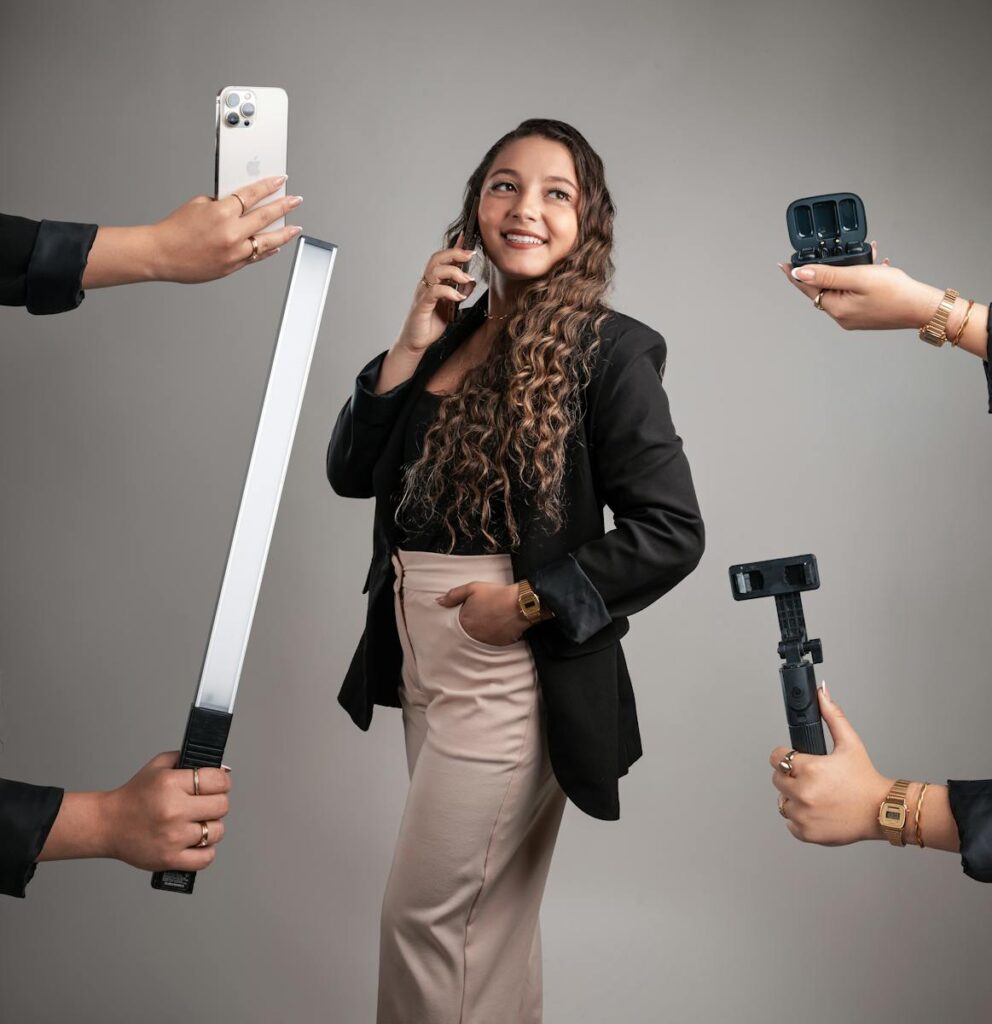 Businesswoman using tech gadgets for productivity and communication. Modern office setting.