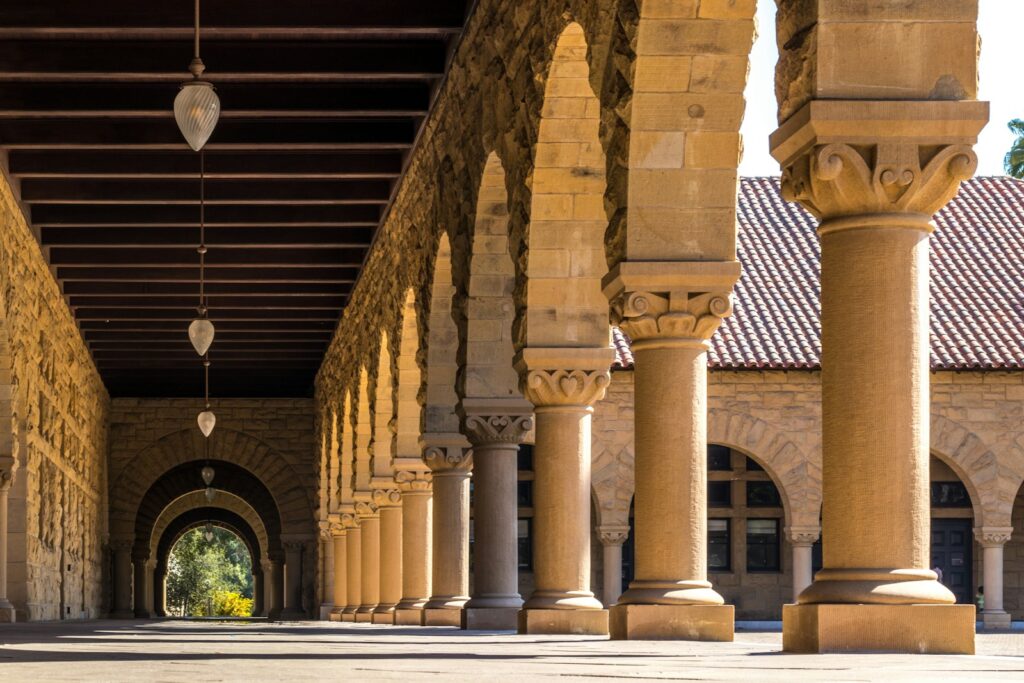 brown concrete hallways with columns