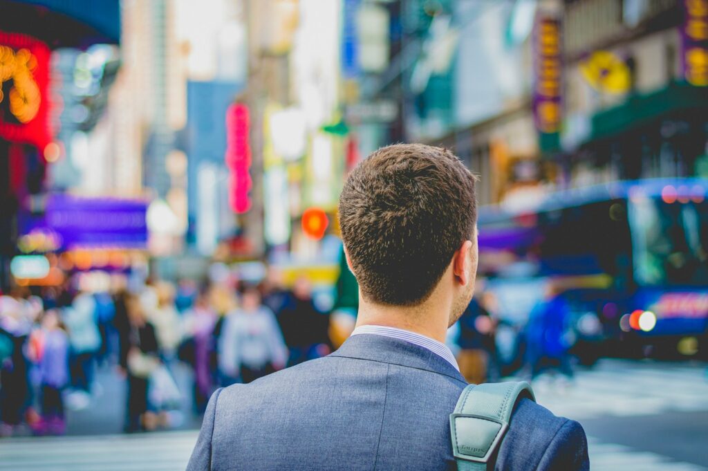 shallow focus photography of man in suit jacket