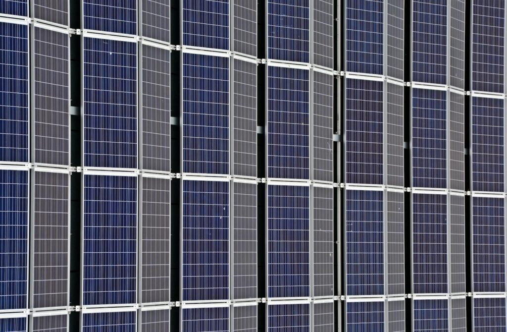 Britain Green Energy Revolution and Now Its Grid Is Paying the Price Close-up of multiple solar panels representing renewable energy and sustainability.
