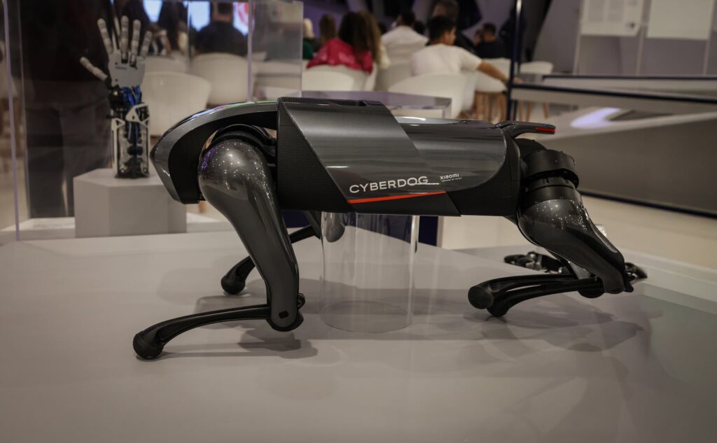 A futuristic robot dog, the Cyberdog, on display in an indoor setting, showcasing advanced robotics technology.