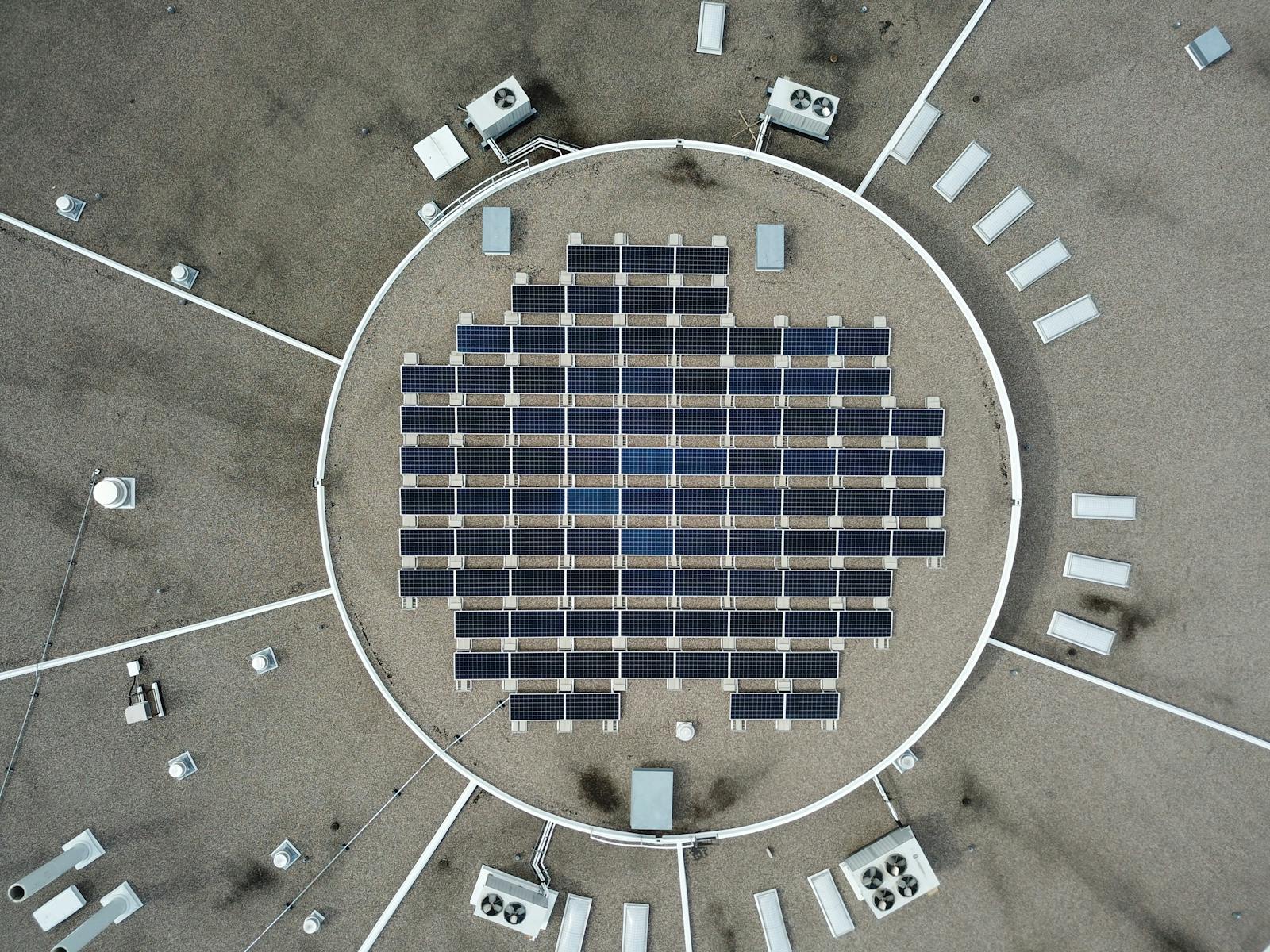 Inside Office Where AI Doomers Gather and Who Built AI Now Warning the World Aerial photo of a solar panel grid on a rooftop, maximizing renewable energy.