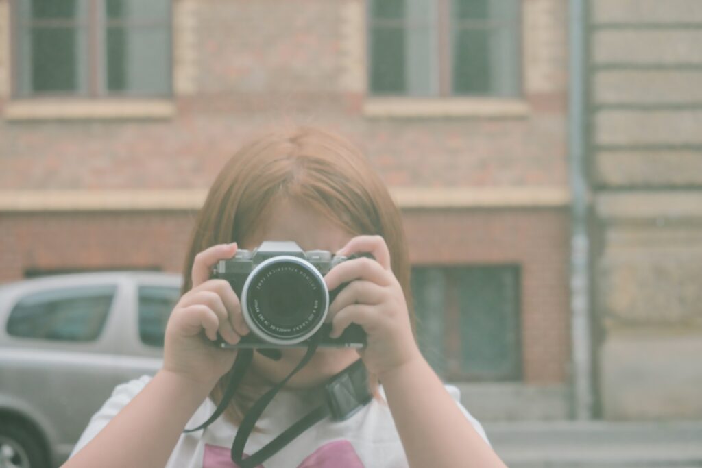 A woman taking a picture with a camera