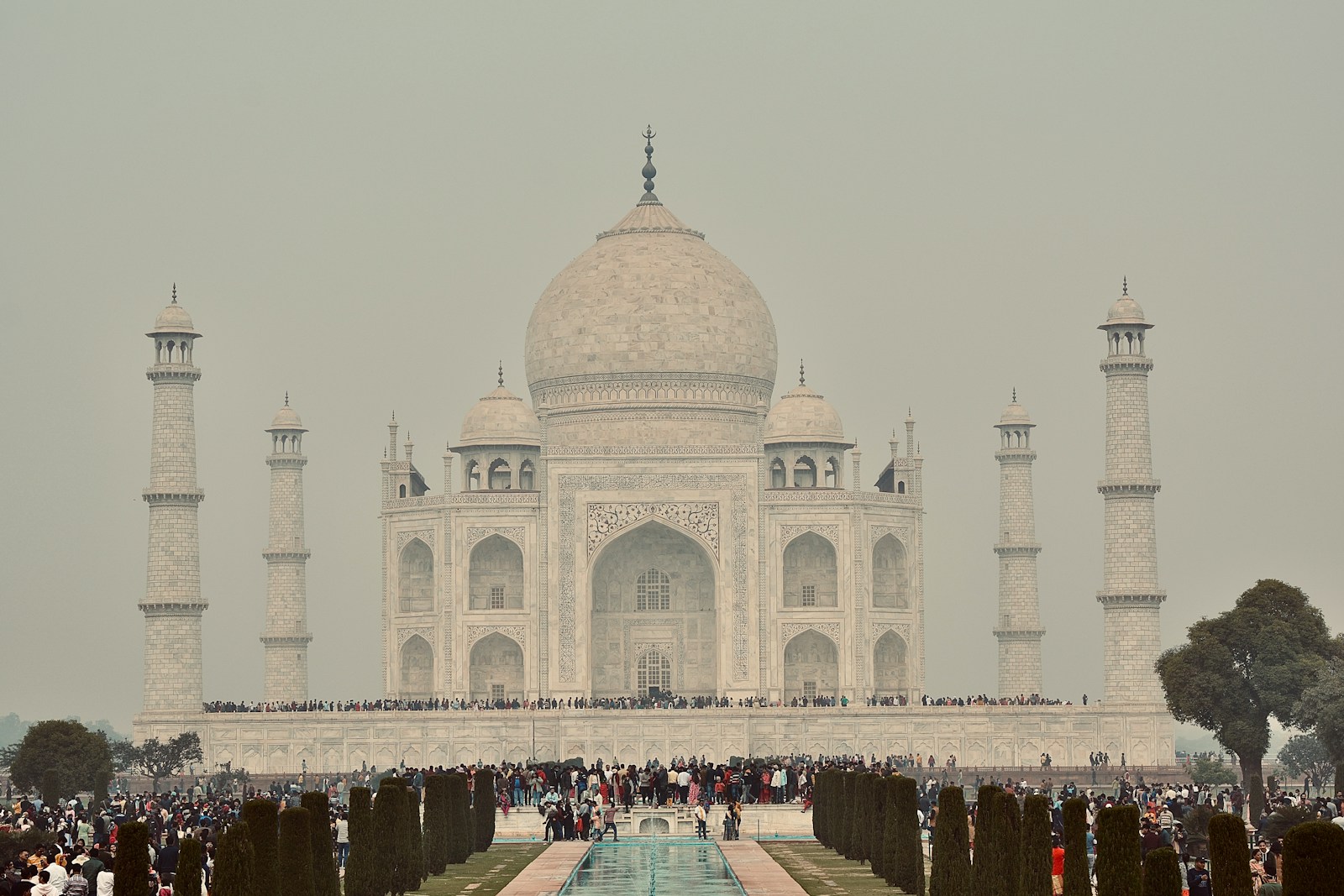 The New Frontline of the Global AI Race a group of people standing in front of a white building