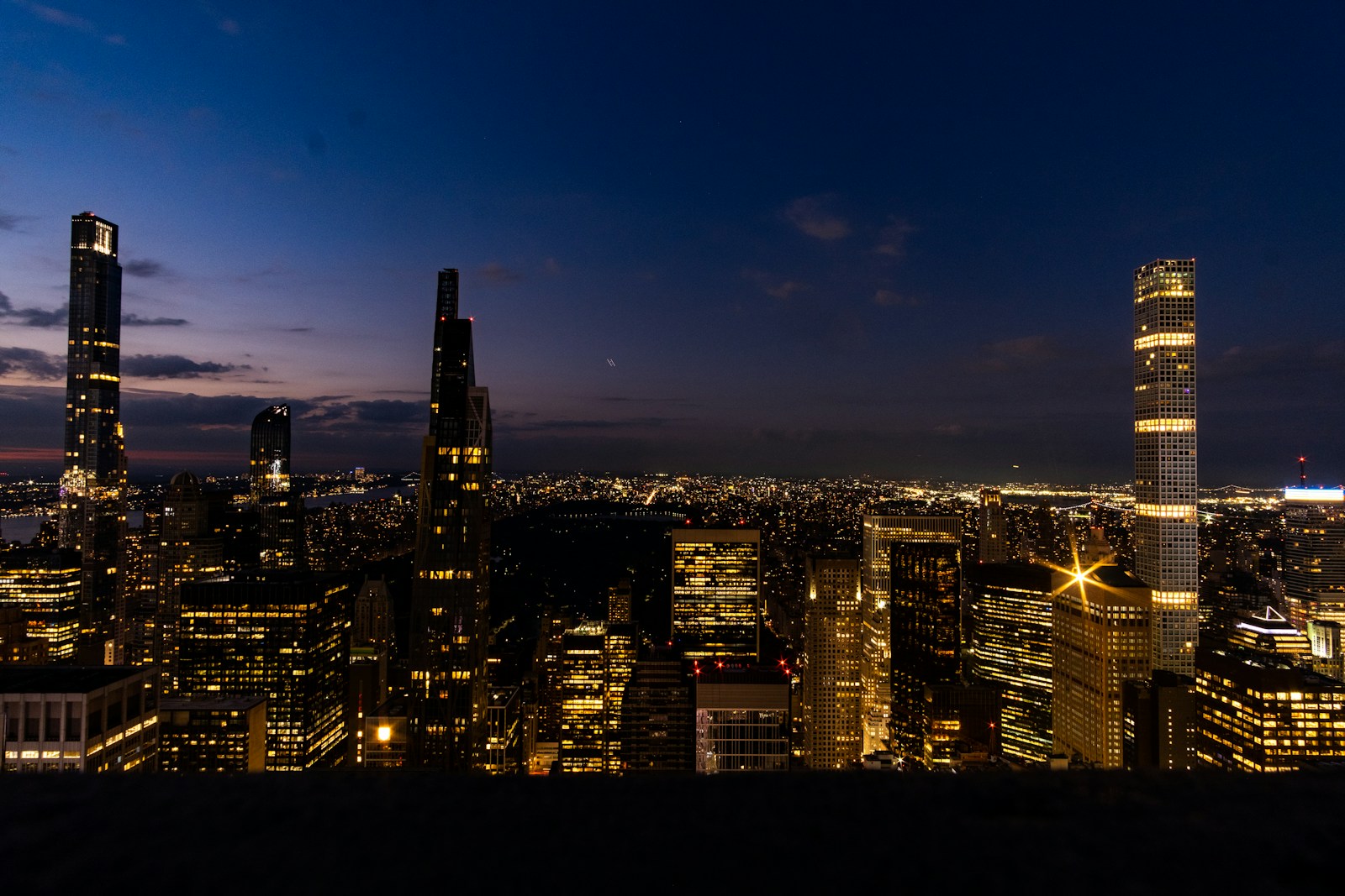 How New AI Billionaires On AI Boom Creating Extreme Wealth a city at night