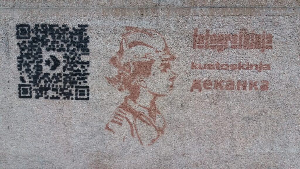 a picture of a person on a wall with a qr code on it