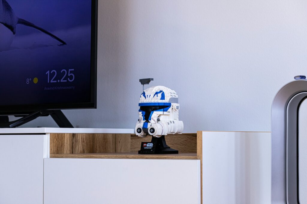 Why Home Robots Still Aren’t Ready for Everyday New Life a robot is sitting on top of a dresser