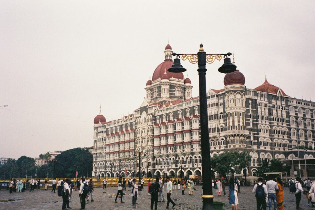 Grand hotel building with people walking outside