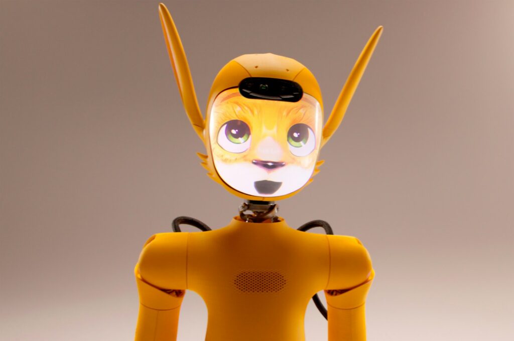 A yellow robot with a cat-like face and ears