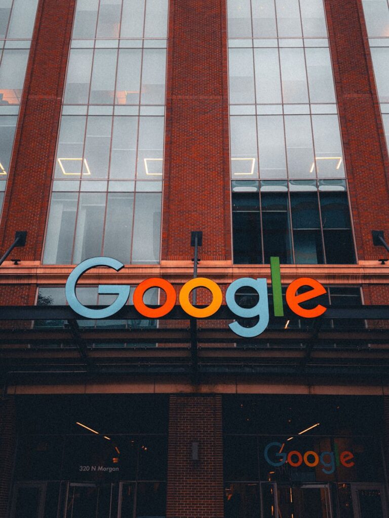 Google’s AI Spending Surge: Why the Company Is Doubling Down Colorful Google logo on modern building exterior in urban environment.