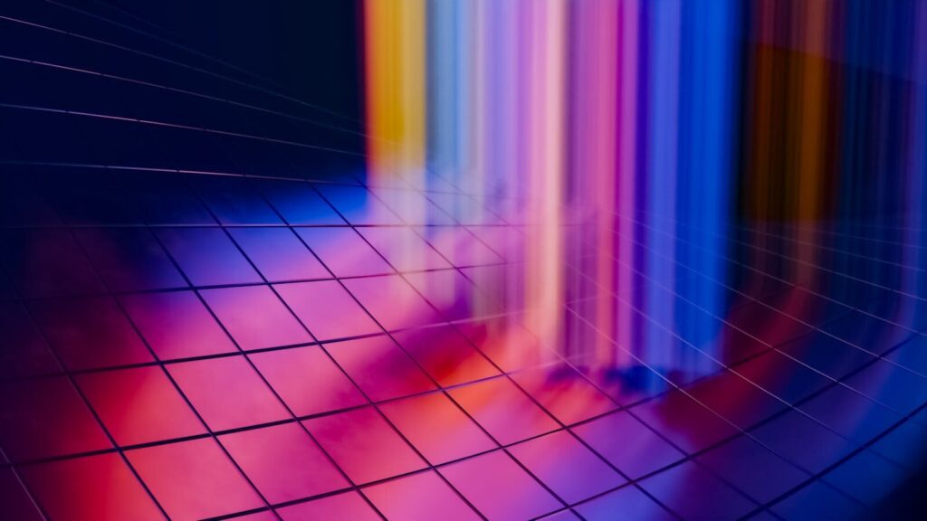 Thermodynamic Computers: A New Radical Leap for Energy-Efficient AI A colorful abstract digital artwork featuring vibrant light streaks on a grid pattern background.