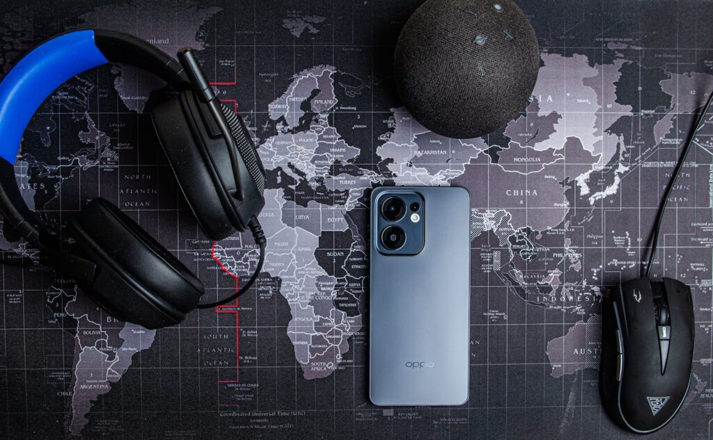 How US Tech Corps Export AI Redefine New Global Power Smartphone, headset, and accessories on a world map background, perfect for tech and travel themes.