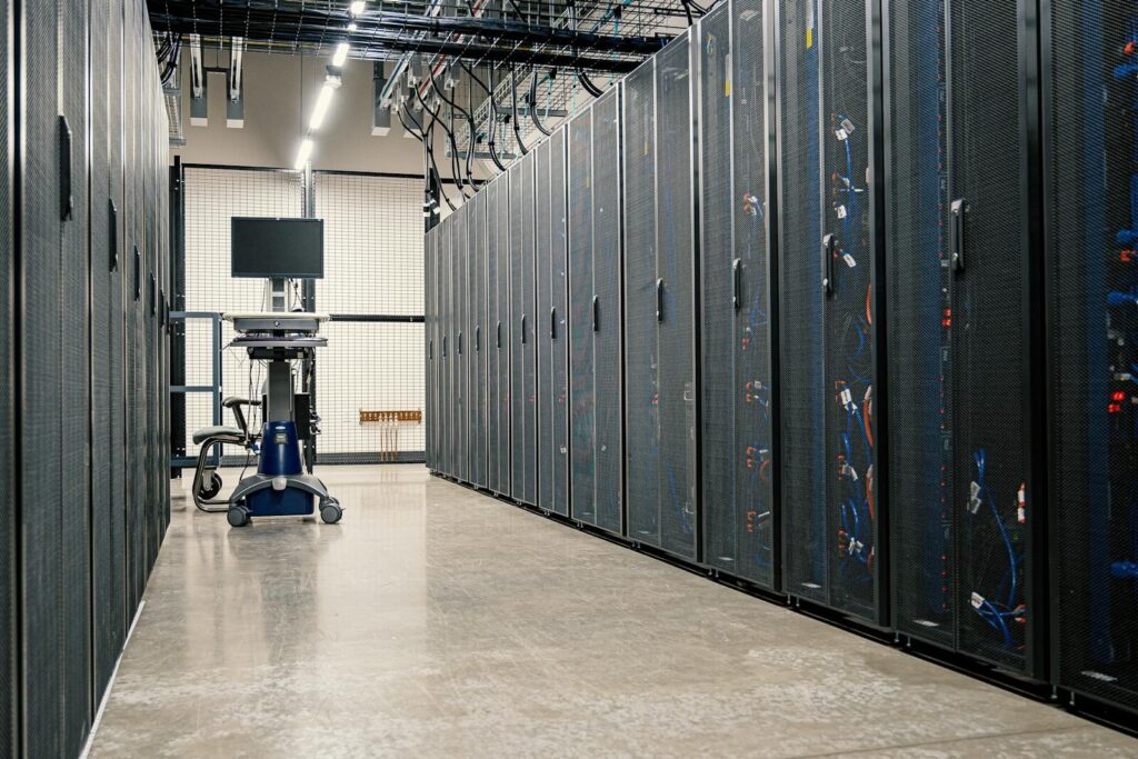 Thermodynamic Computers: A New Radical Leap for Energy-Efficient AI Modern data center corridor with server racks and computer equipment. Ideal for technology and IT concepts.