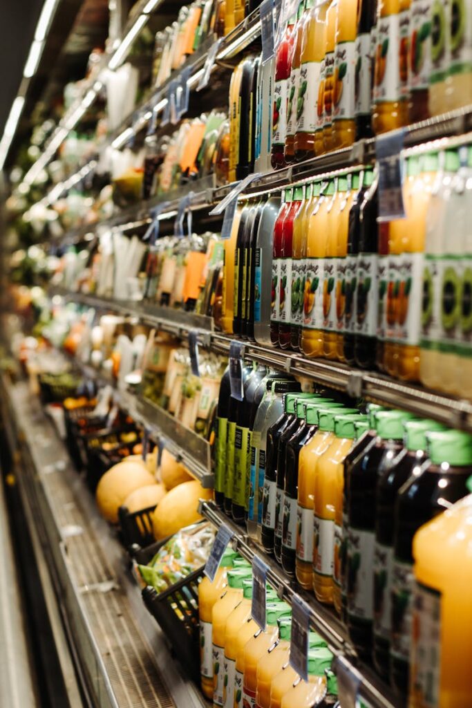 Vibrant array of bottled beverages on display in a Brazilian supermarket aisle.
