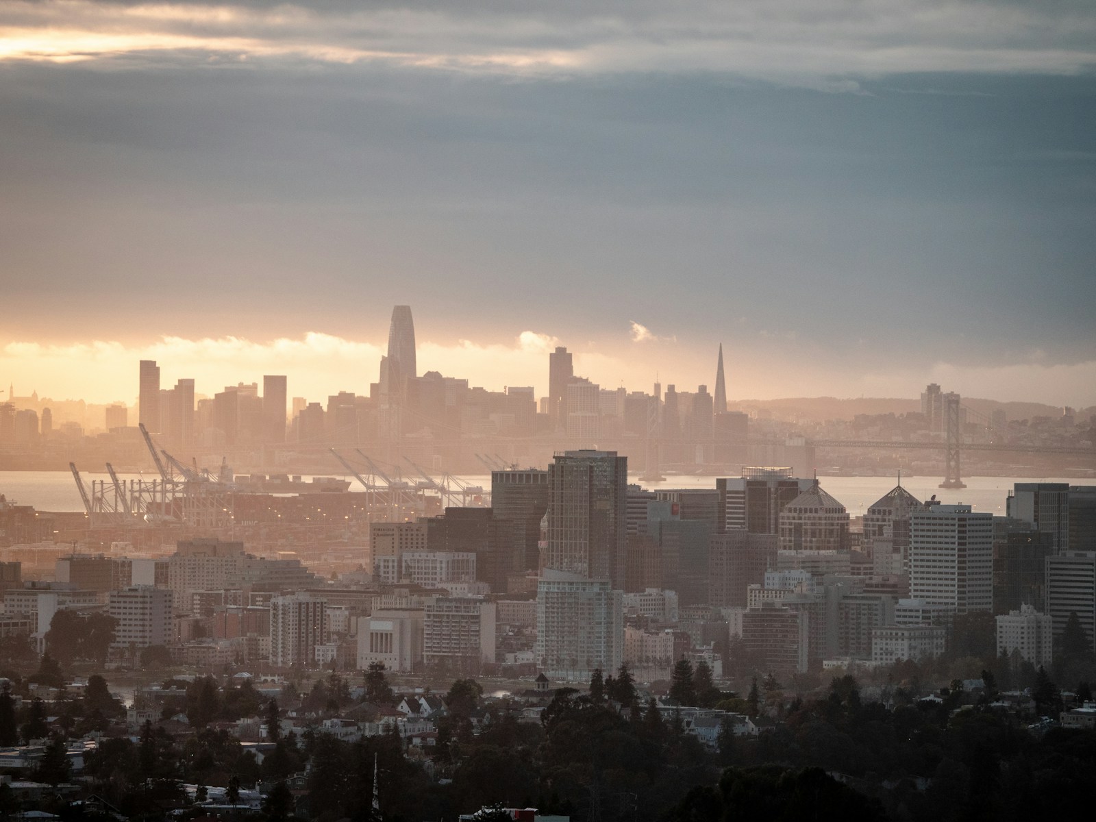 The New Faces of AI in San Francisco city skyline under orange sunset