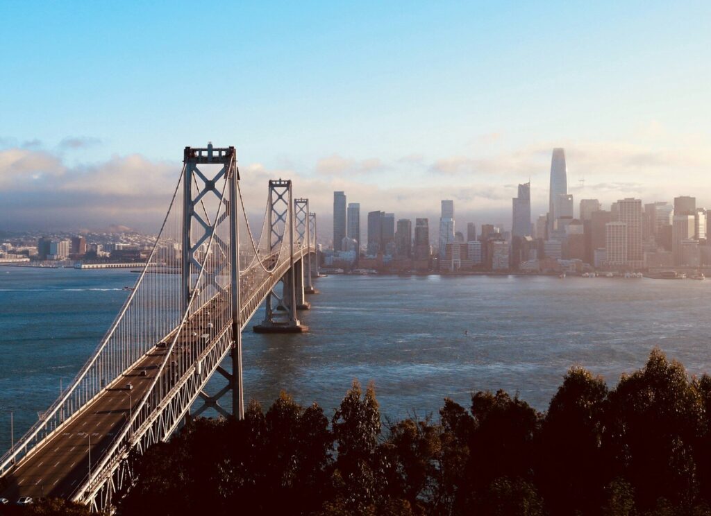 Inside San Francisco’s New AI Startup Frenzy San francisco bay bridge and city skyline at sunset