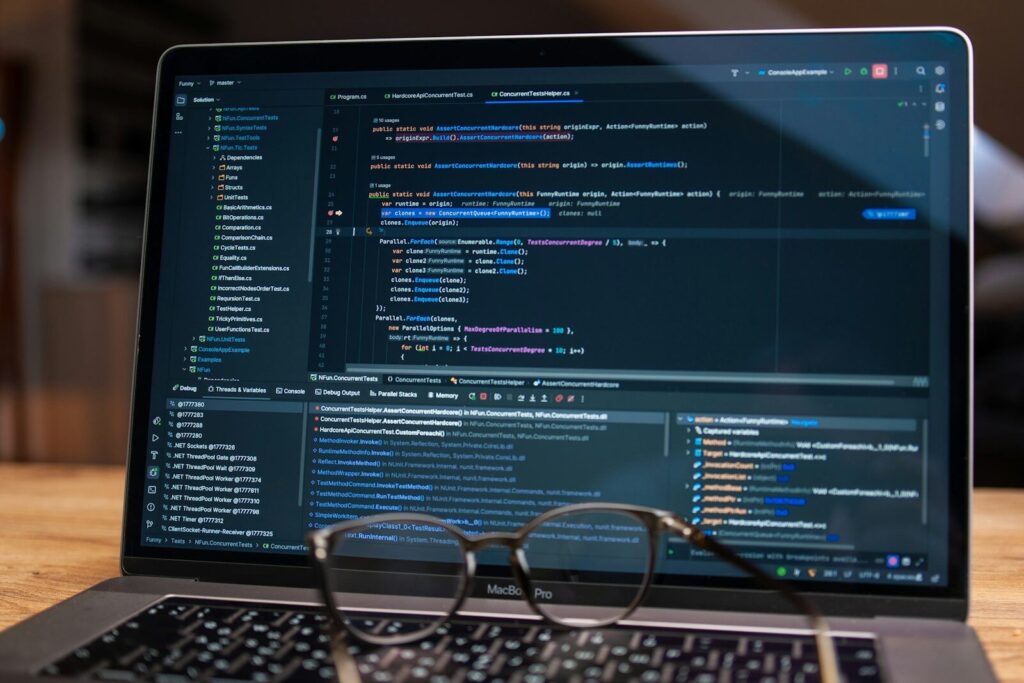 The Science of Talking to New AI Get Smarter More Useful Answers from Chatbots Laptop screen displaying lines of code with glasses.