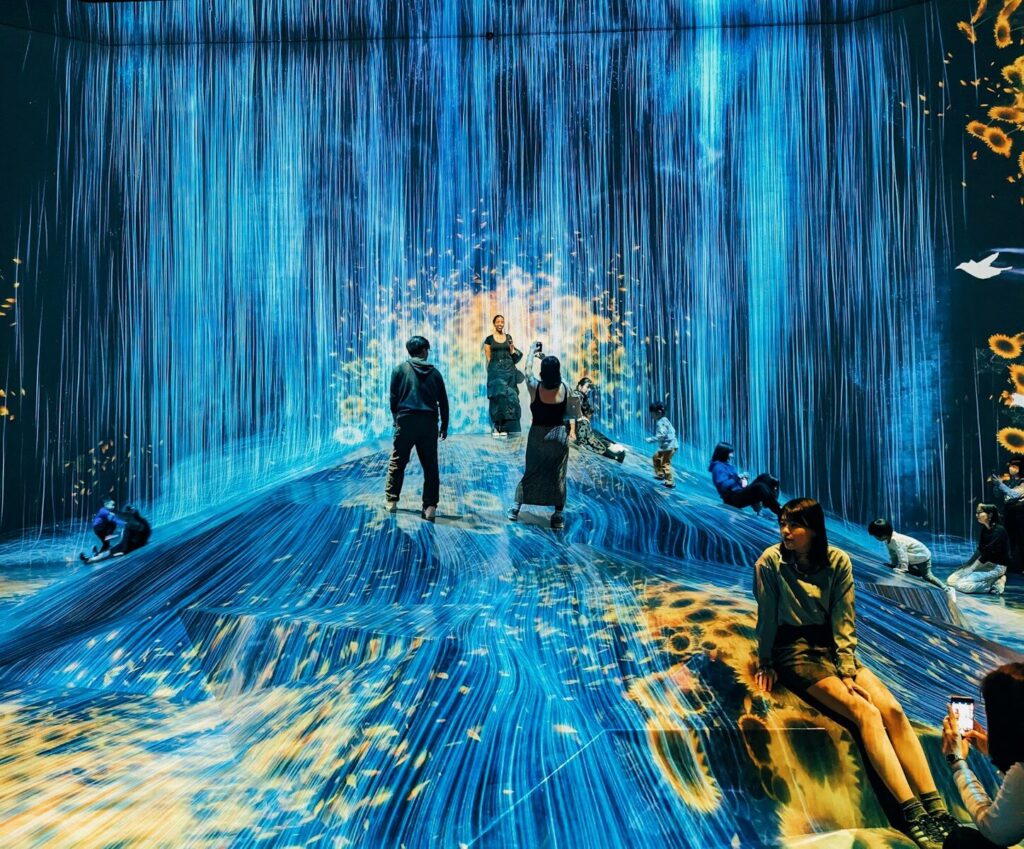 What’s Left for Humans in the New Age of AI? A group of people standing in a blue room