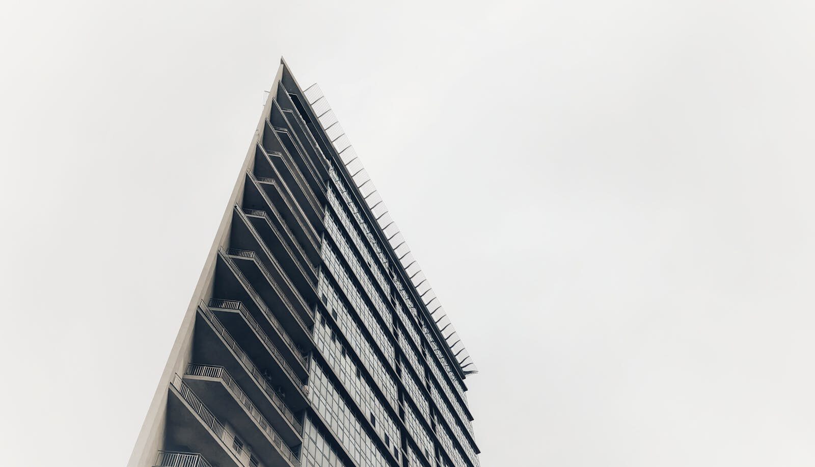 Low-angle view of a modern high-rise building in Kyiv showcasing architectural design.