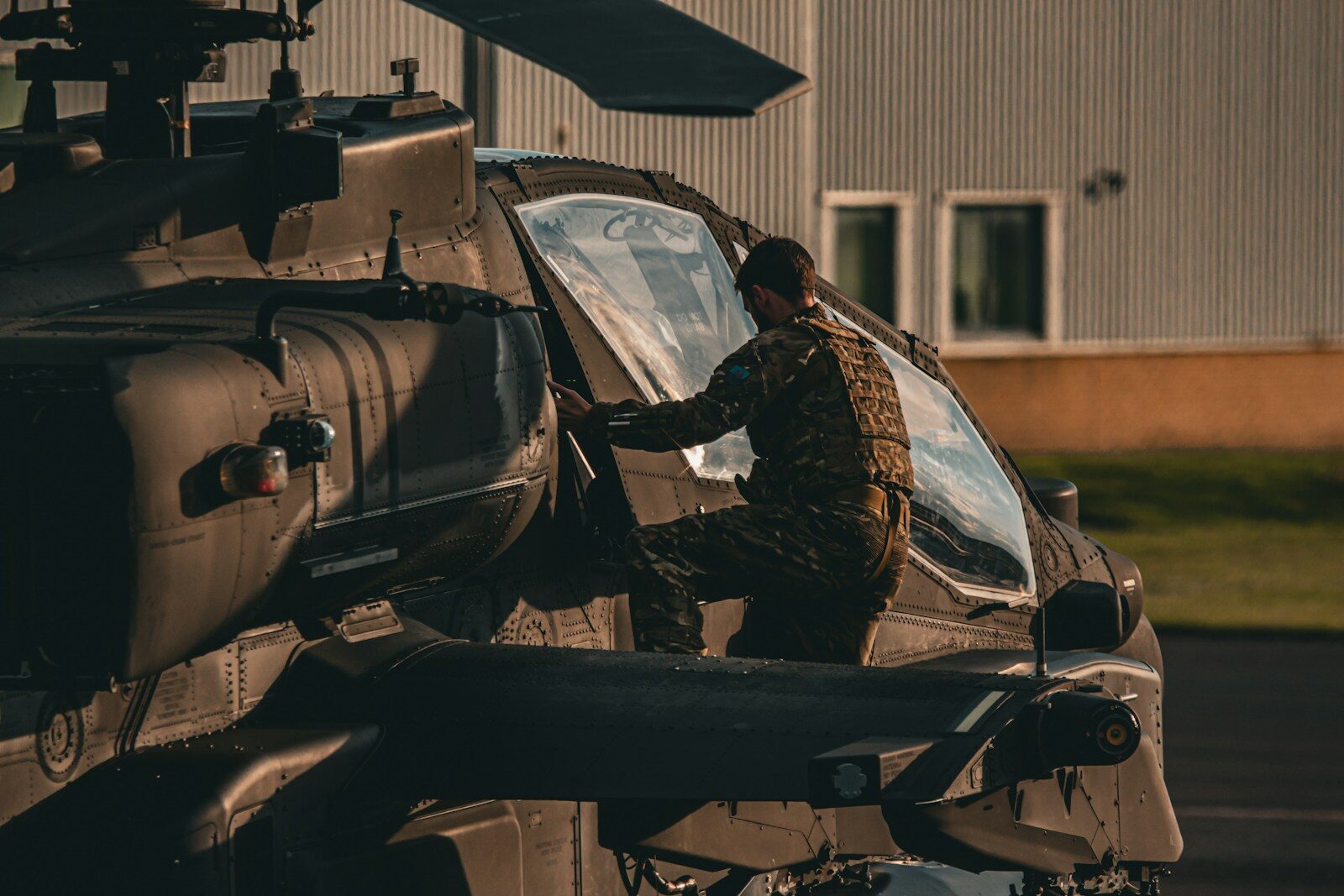 A man standing in front of a helicopter