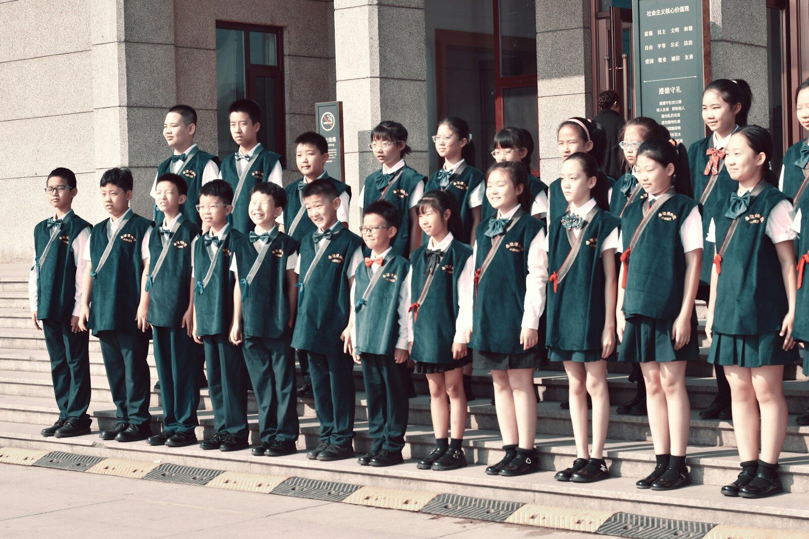 China’s Parents Outsourcing the Homework Grind to New AI A group of children standing in front of a building