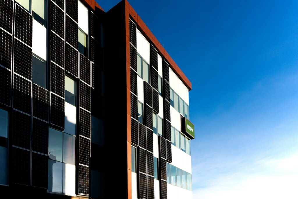 Modern building facade against a clear blue sky