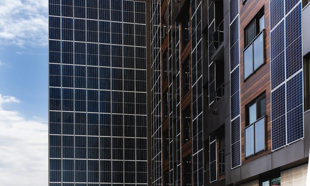 Modern building facade with solar panels and windows