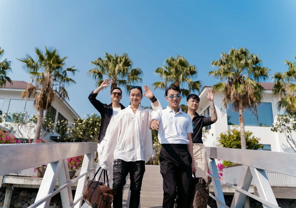 a group of men standing on top of a bridge