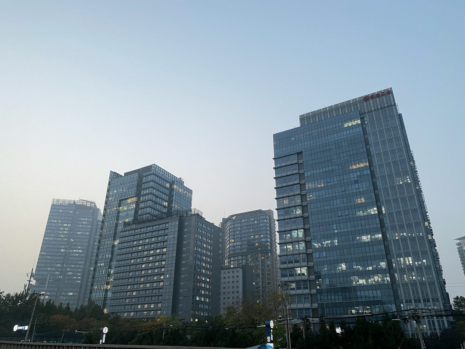 Modern glass skyscrapers against a clear sky