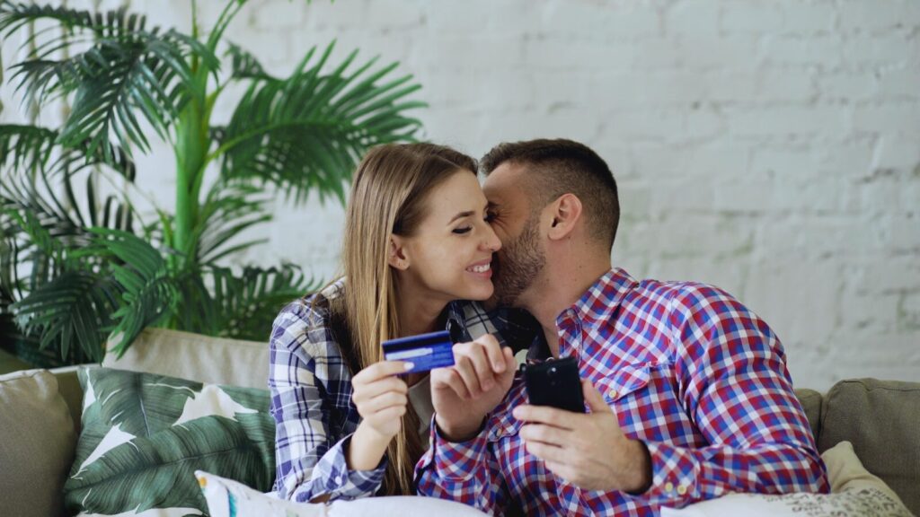 Couple holding credit card and phone, smartphone,phone, phone