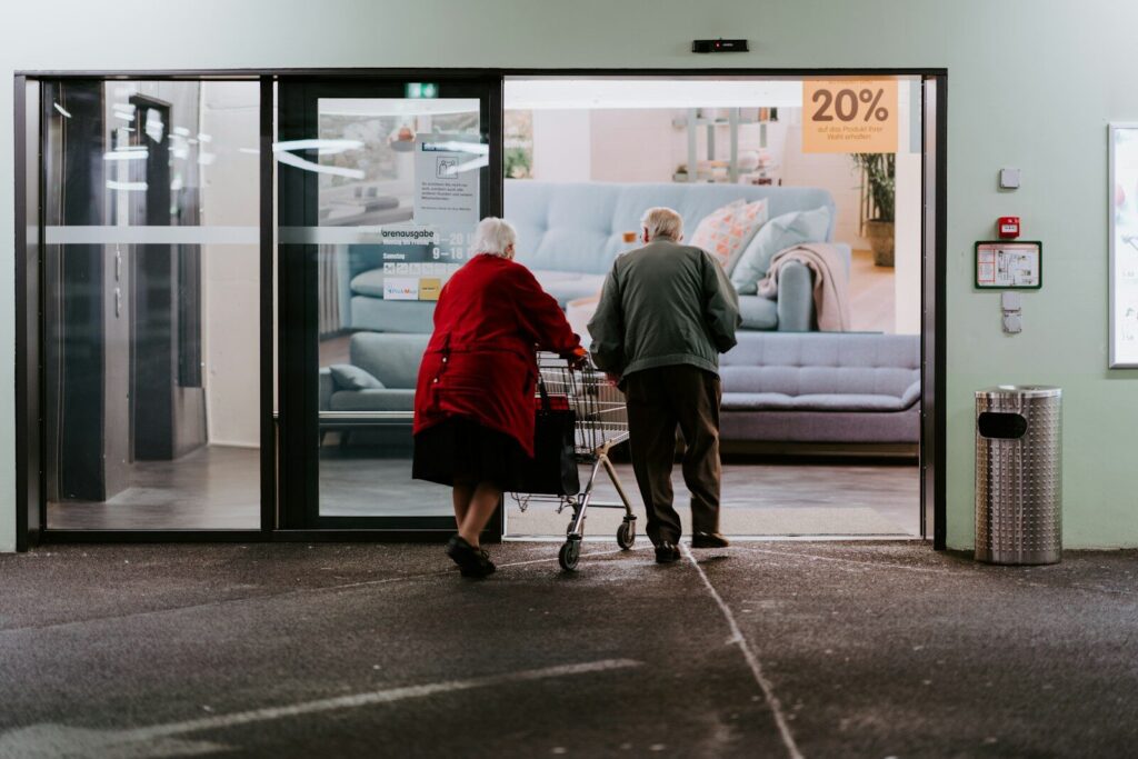 The New AI Robot Transforming Senior Care and Human Aging man in red shirt and black pants sitting on black and silver wheel chair