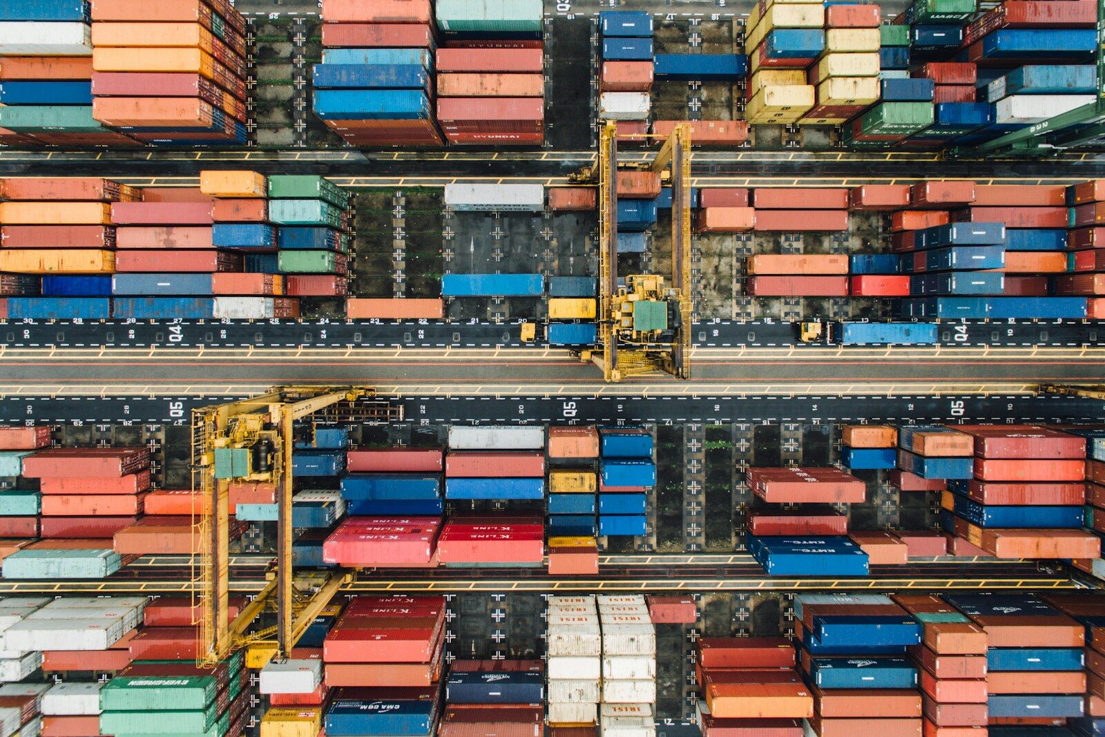 The Global Supply Chain Crisis Slowing New Future of Intelligence aerial photo of pile of enclose trailer
