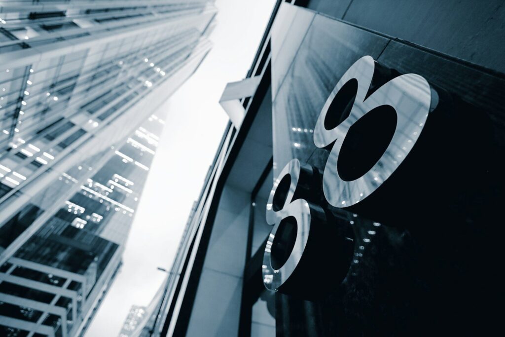 A black and white photo of a building with the number 60 on it