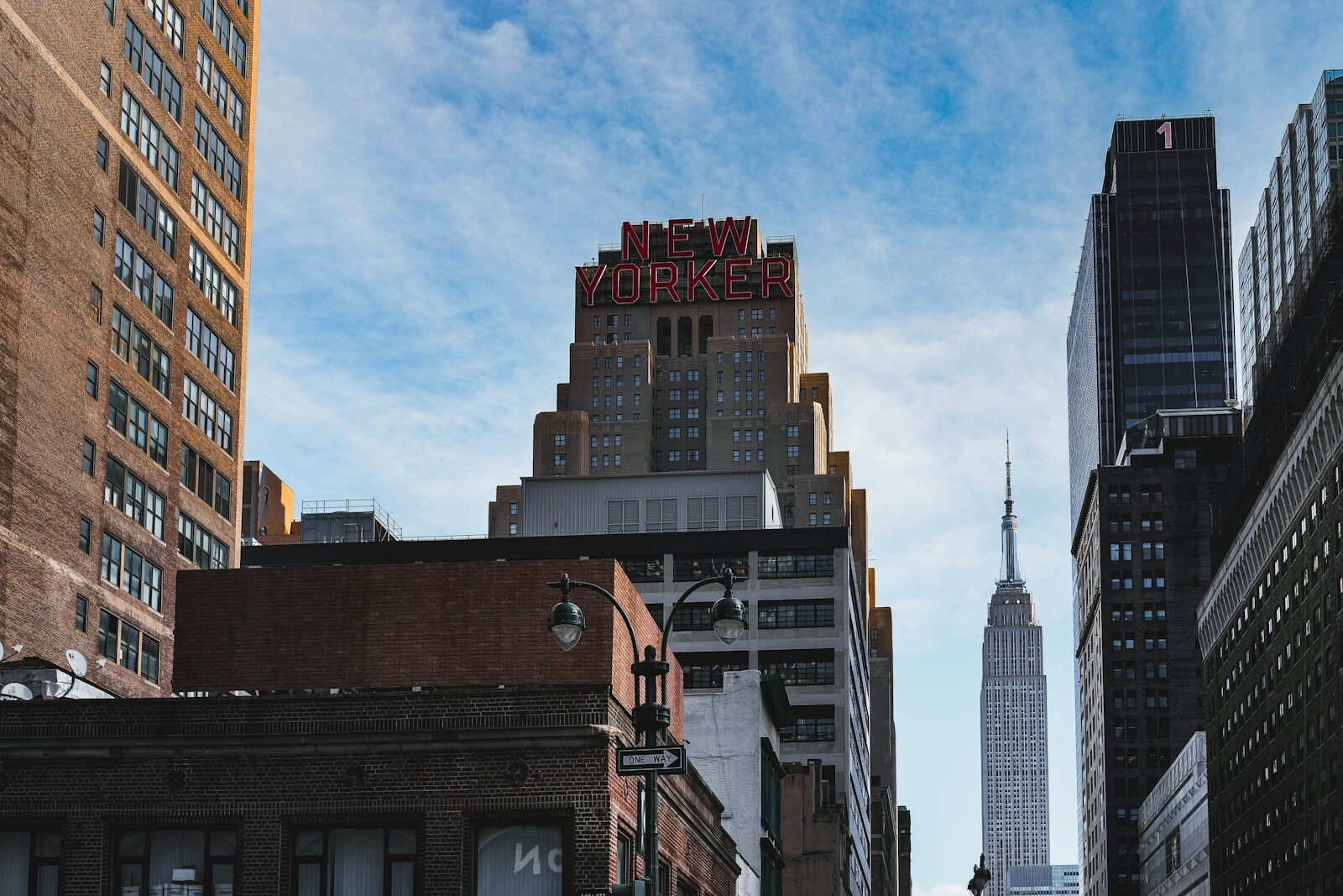 a city street with tall buildings and a sign that says new york