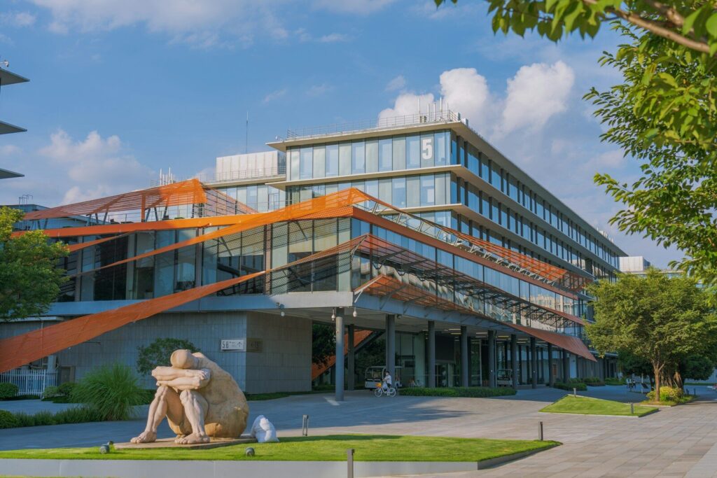 Alibaba’s New “HappyHorse” AI Just Raised the Bar for Video Generation a large building with a sculpture in front of it