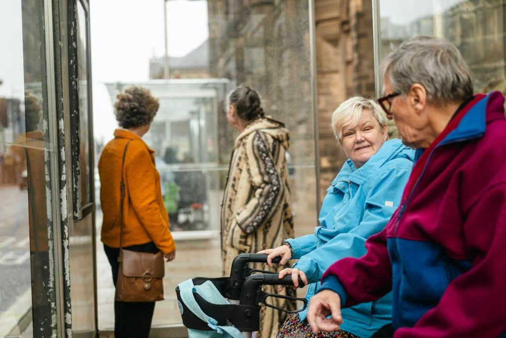 Elderly people waiting at a bus stop