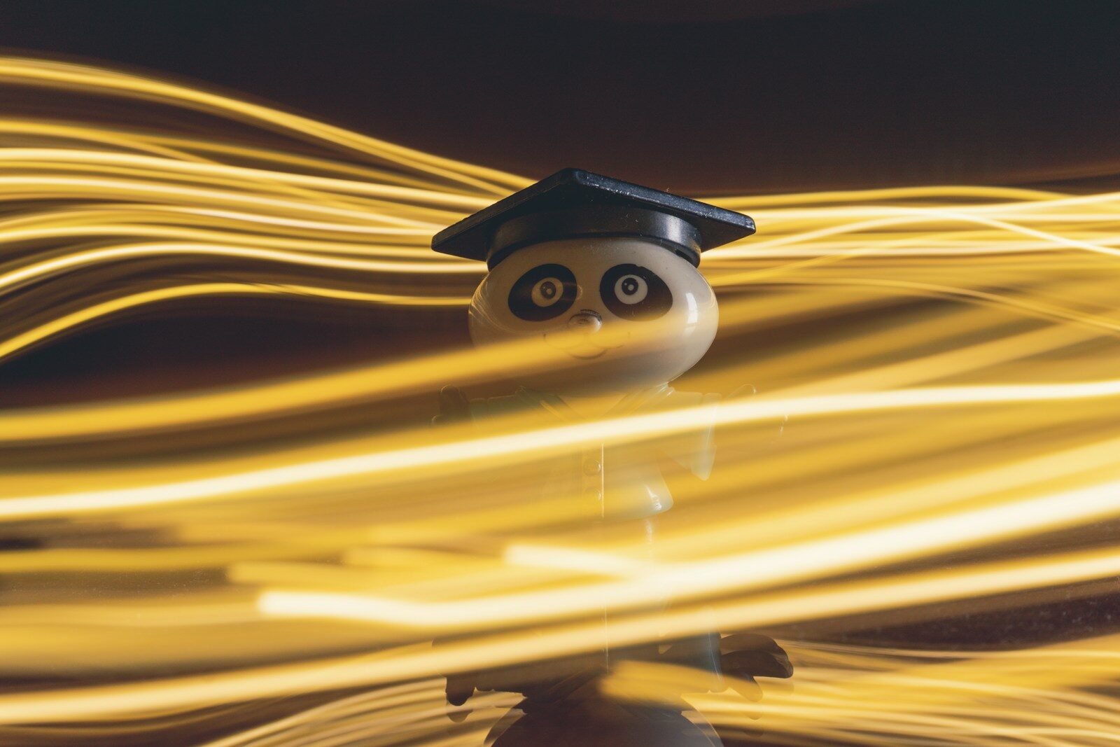 What A.I. Kant Do: Why AI Forcing New Liberal Rethink a small toy with a graduation cap on top of it