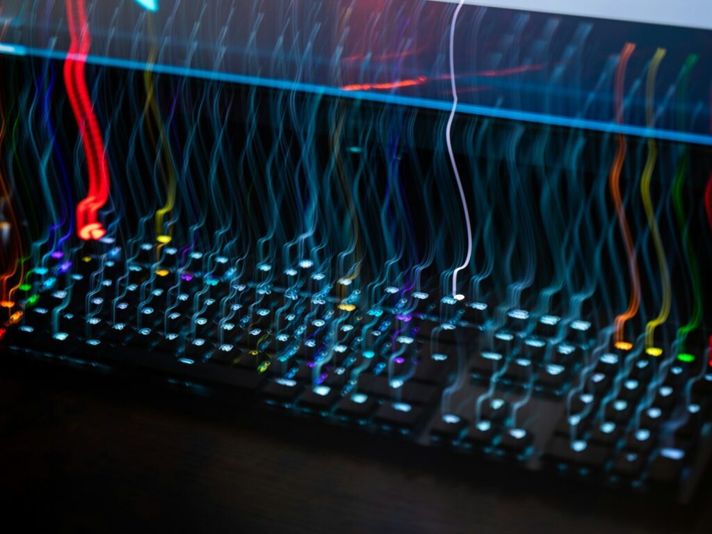 🚀“Vibe Coding in Science” Rewiring How New Research Gets Done a close up of a computer keyboard with colorful lights