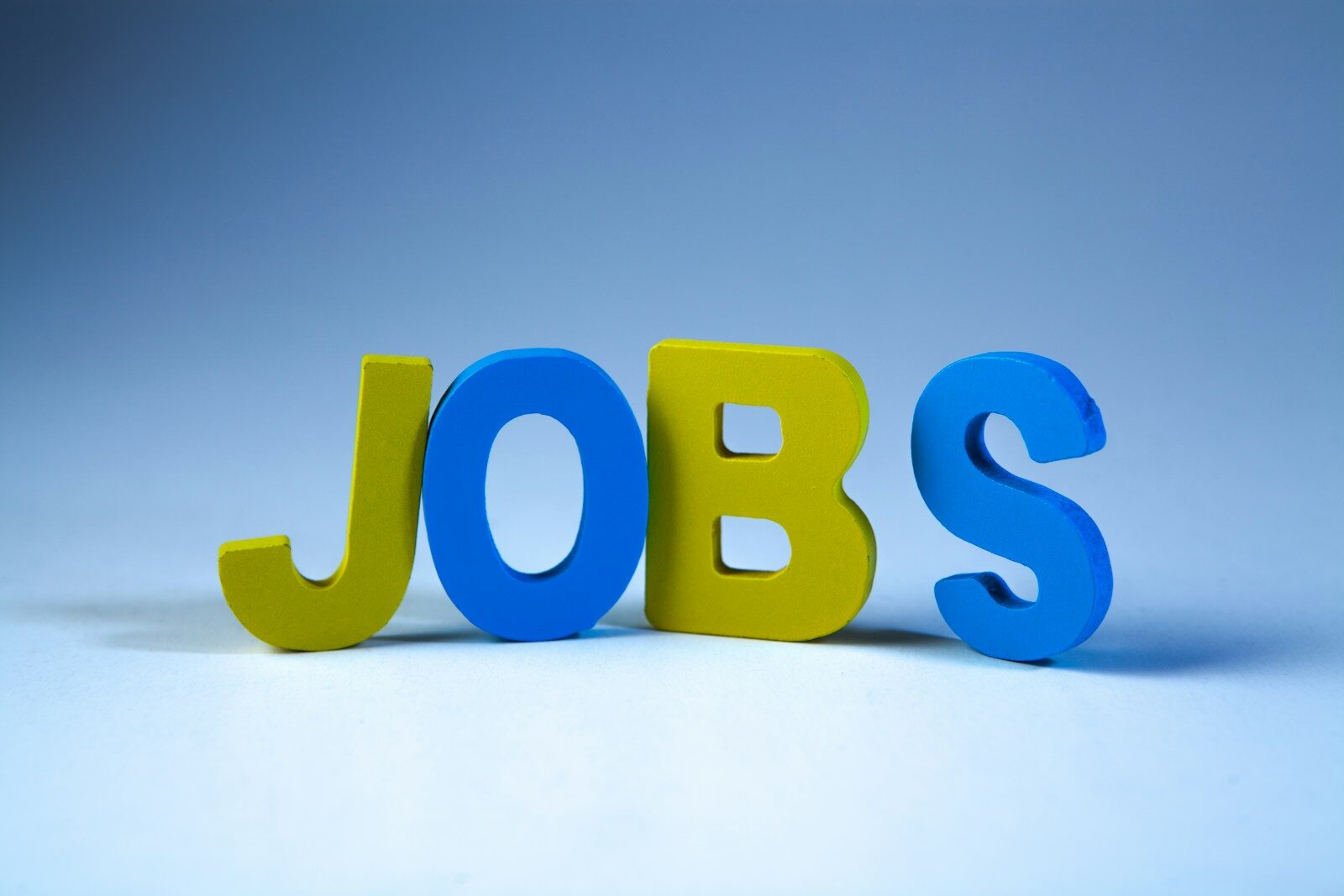 AI Is not Just Changing Jobs Anymore, It’s What Makes Humans Valuable at Work The word jobs in colorful block letters