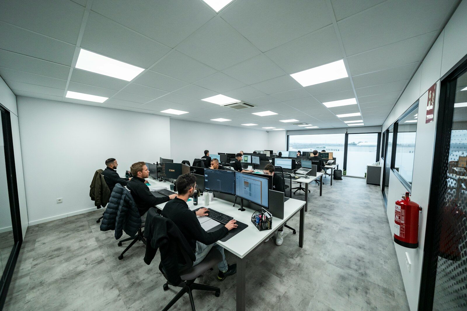 Office workers are busy working on computers.