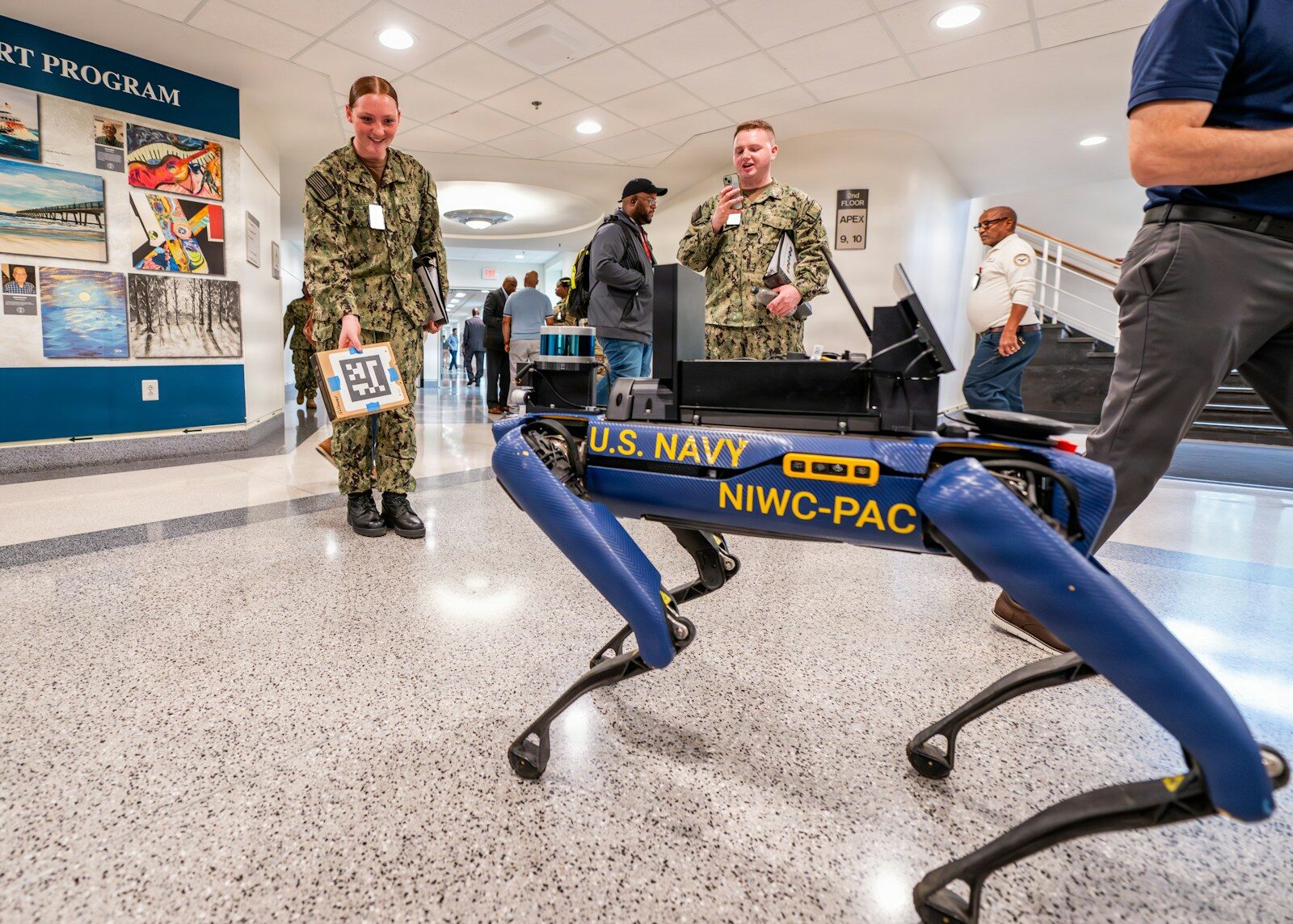 Navy personnel with a u.s. navy robotic dog