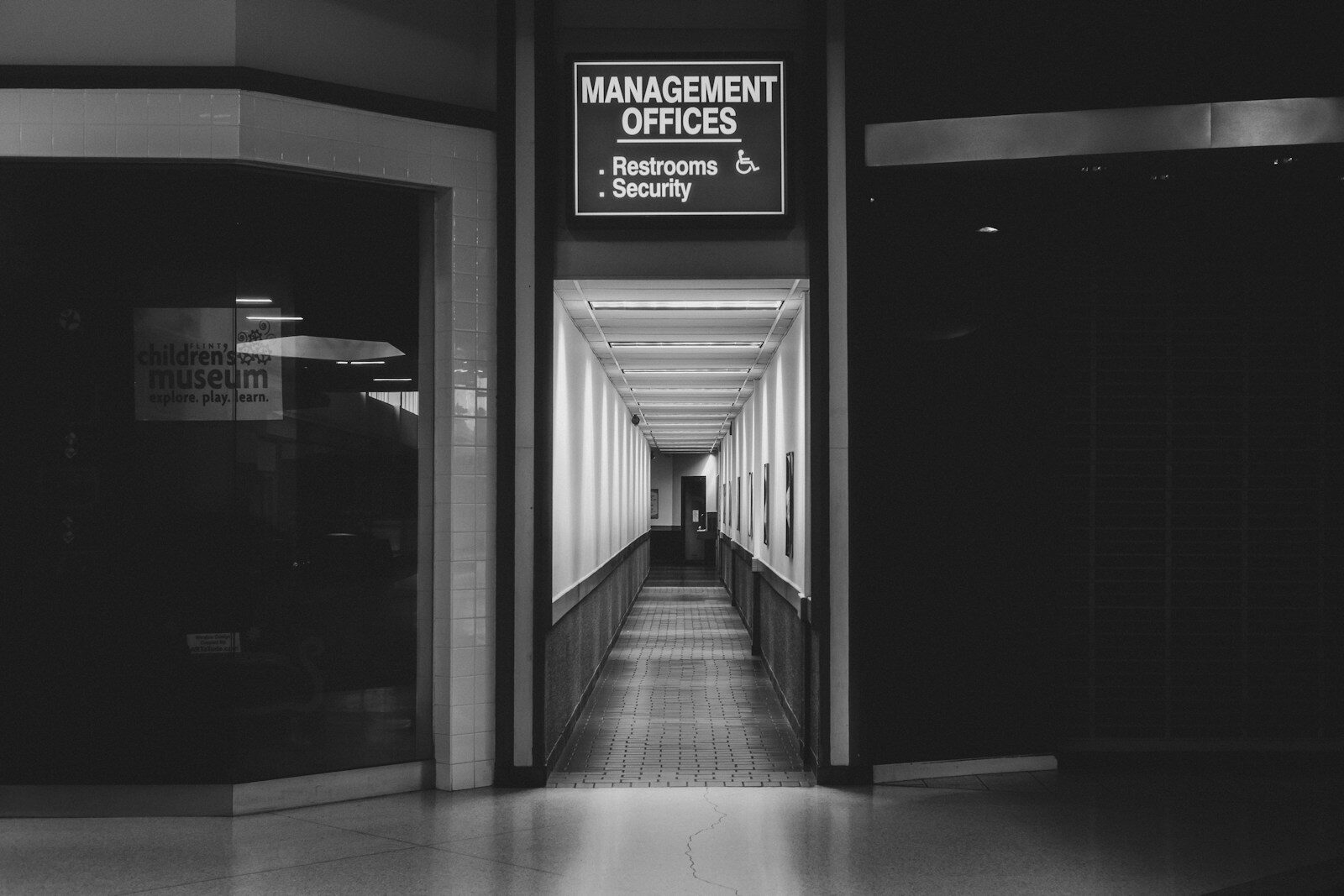 a black and white photo of a hallway