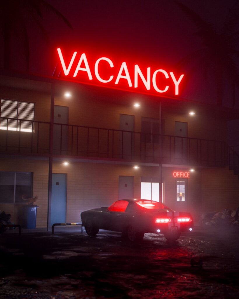 Retro car parked outside motel with vacancy sign