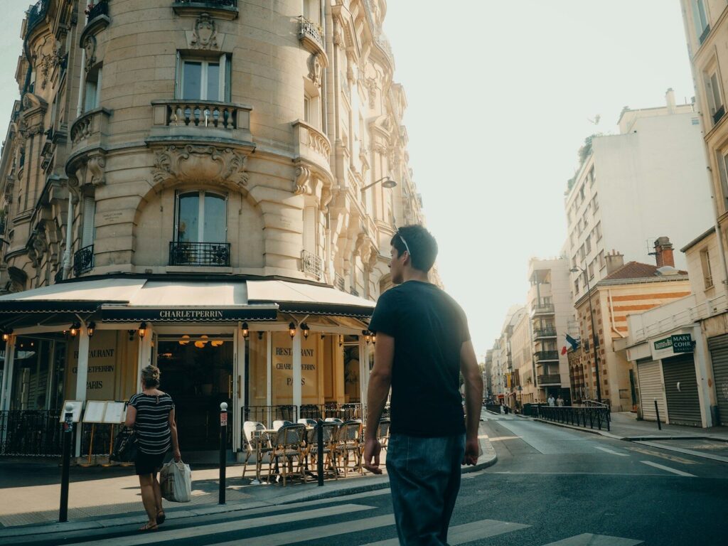 Why France’s Mistral Is Challenging America’s Dominance in New AI Man walks down a sunny european street.