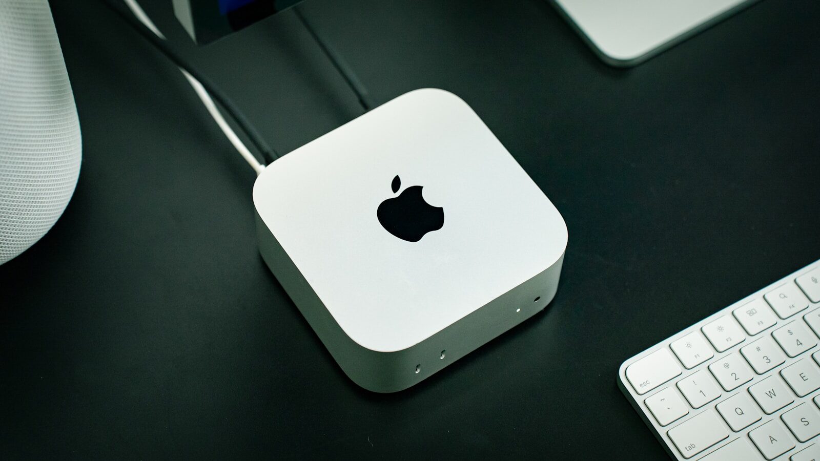 Why Perplexity Is Giving Out New Mac Minis and Future AI Personal Computers A close up of an apple mouse and keyboard